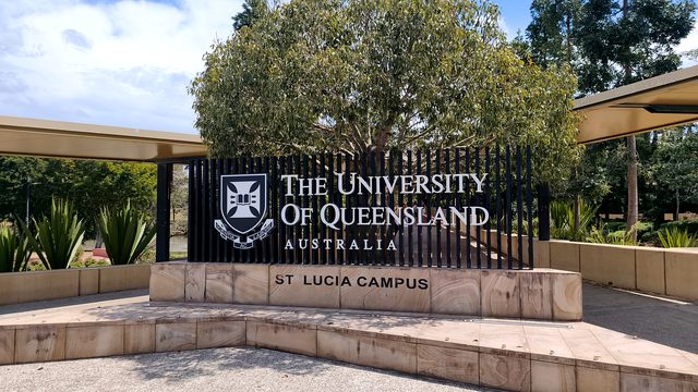 The University of Queensland St Lucia Campus sign beside the bus station